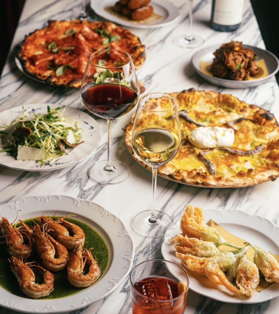 A table full of plates with food